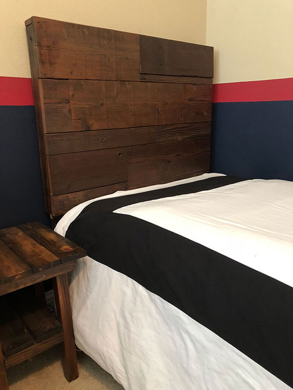 Transform your bedroom into a cozy and rustic retreat with a farm-style barn wood headboard, expertly crafted from reclaimed wood for a sustainable and eco-friendly addition to your decor.