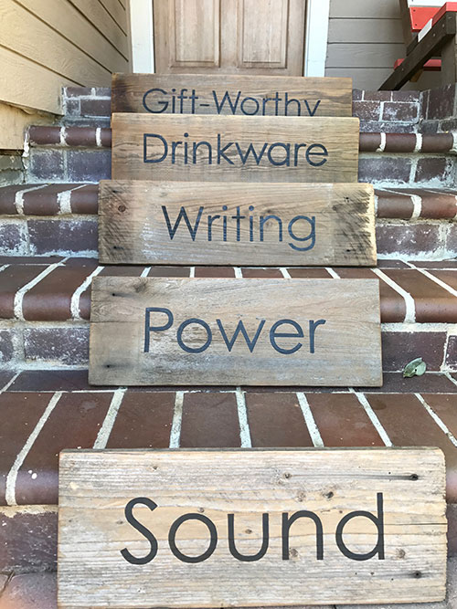 Custom hand painted barn wood Signage for a company swag store by Urban Garden Studio Make a statement with custom hand-painted barn wood signage by Urban Garden Studio, the perfect addition to any company swag store. Expertly designed and crafted for a unique and personalized touch, this signage is both stylish and sustainable, adding rustic charm to your brand identity