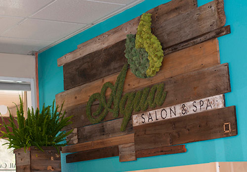 Eco-friendly brand moss signage featuring reclaimed wood, custom logo wrapped in preserved moss, and hand-painted details, making a visually striking and unique statement for your brand by Urban Garden Studio.