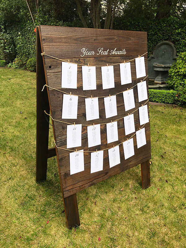 Custom Handmade Rustic Barn Wood Table Seating Sign for Weddings by Urban Garden Studio. Personalized Rustic Wedding Table Seating Sign on Free-Standing A-Frame Barn Wood by Urban Garden Studio.