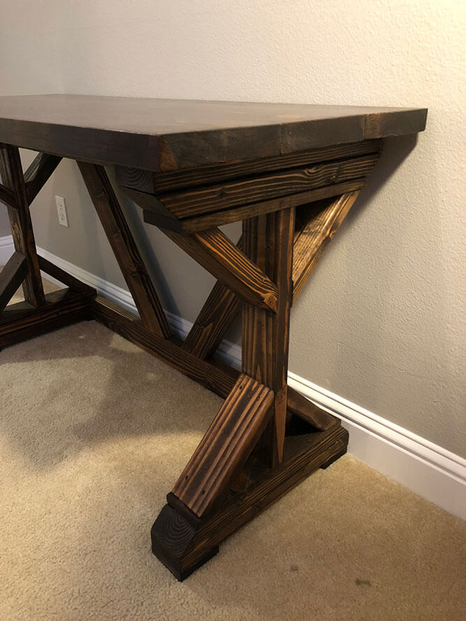 Upgrade your home office with a rustic reclaimed wood desk by Urban Garden Studio, expertly handcrafted for a unique and sustainable addition to your workspace. This desk combines functionality and style, adding natural beauty and charm to your home decor.