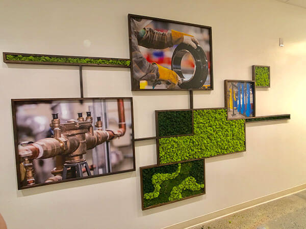 Custom office art featuring rustic wood frames and preserved moss boxes arranged in a unique grid pattern by Urban Garden Studio