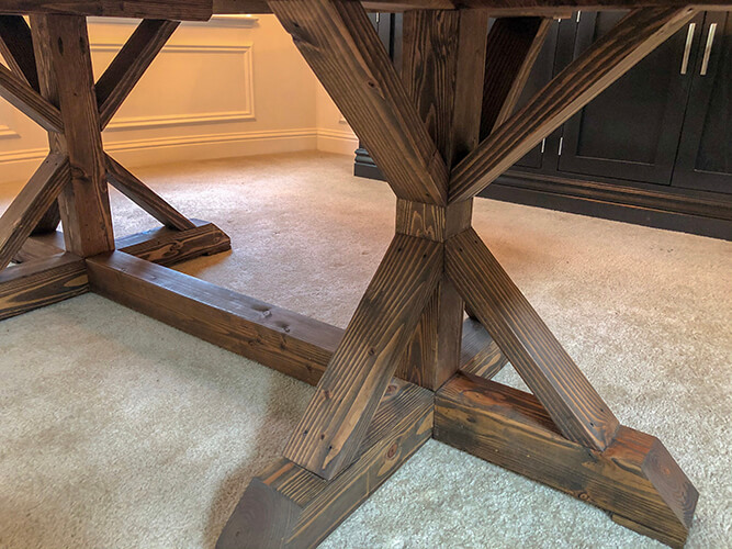 Upgrade your dining experience with a one-of-a-kind reclaimed wood dining room table stained in walnut by Urban Garden Studio, expertly handcrafted from sustainable materials for a unique and eco-friendly addition to your home decor.