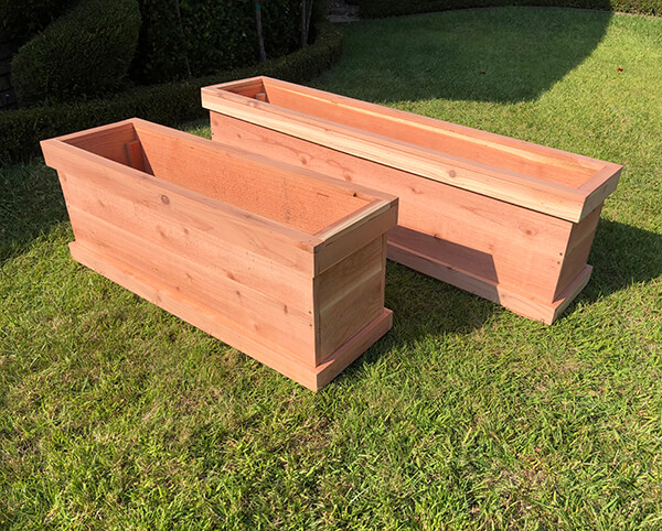 Custom redwood raised planter box makes a perfect vegetable planter. Custom made in any size.