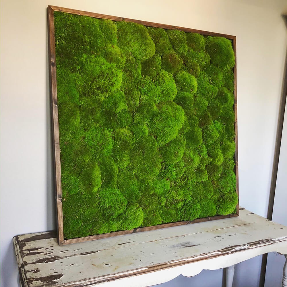 Custom solid preserved cushion moss wall in rustic wood frame - unique and sustainable design by Urban Garden Studio.