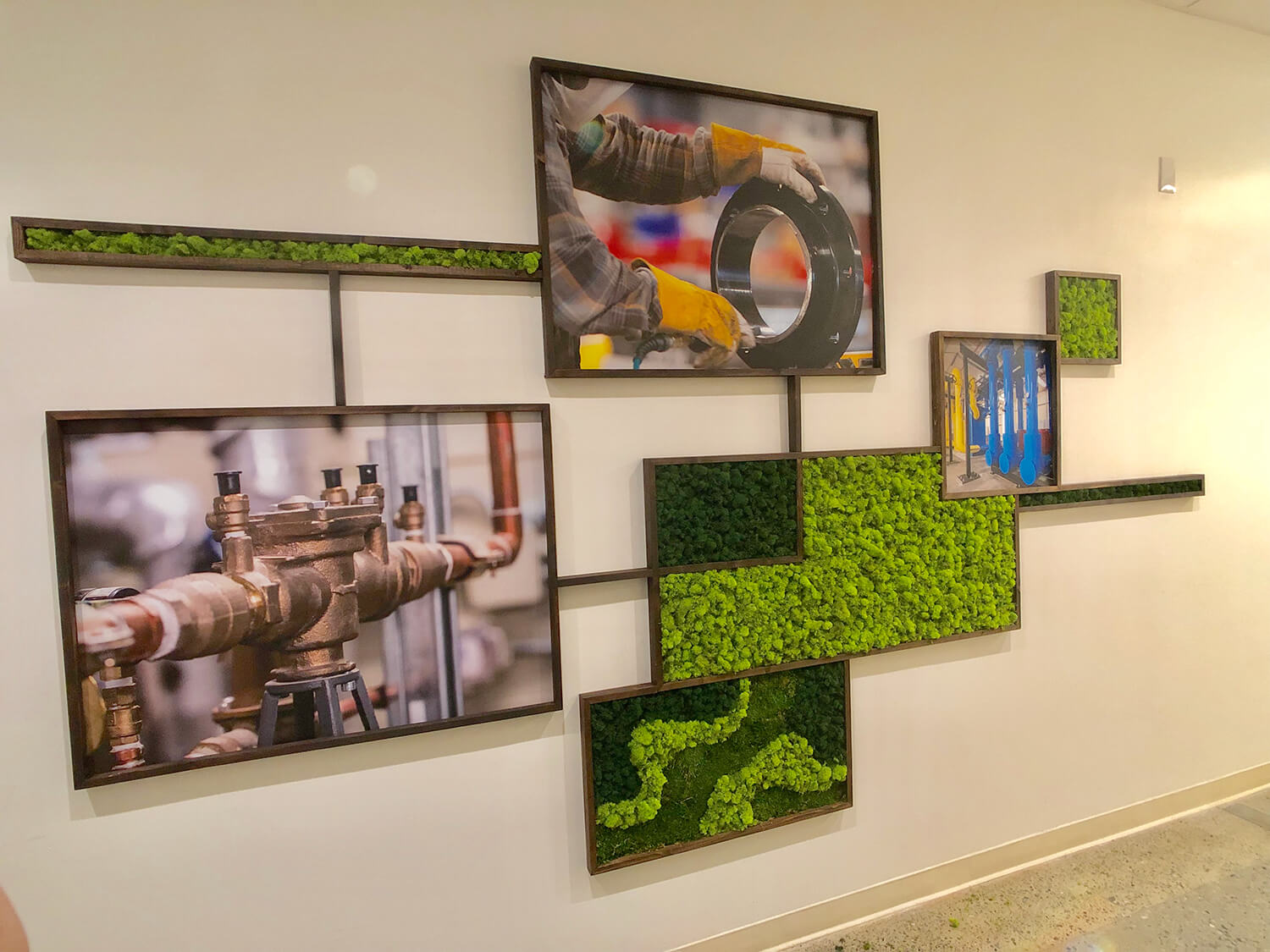 Custom office art featuring rustic wood frames and preserved moss boxes arranged in a unique grid pattern by Urban Garden Studio