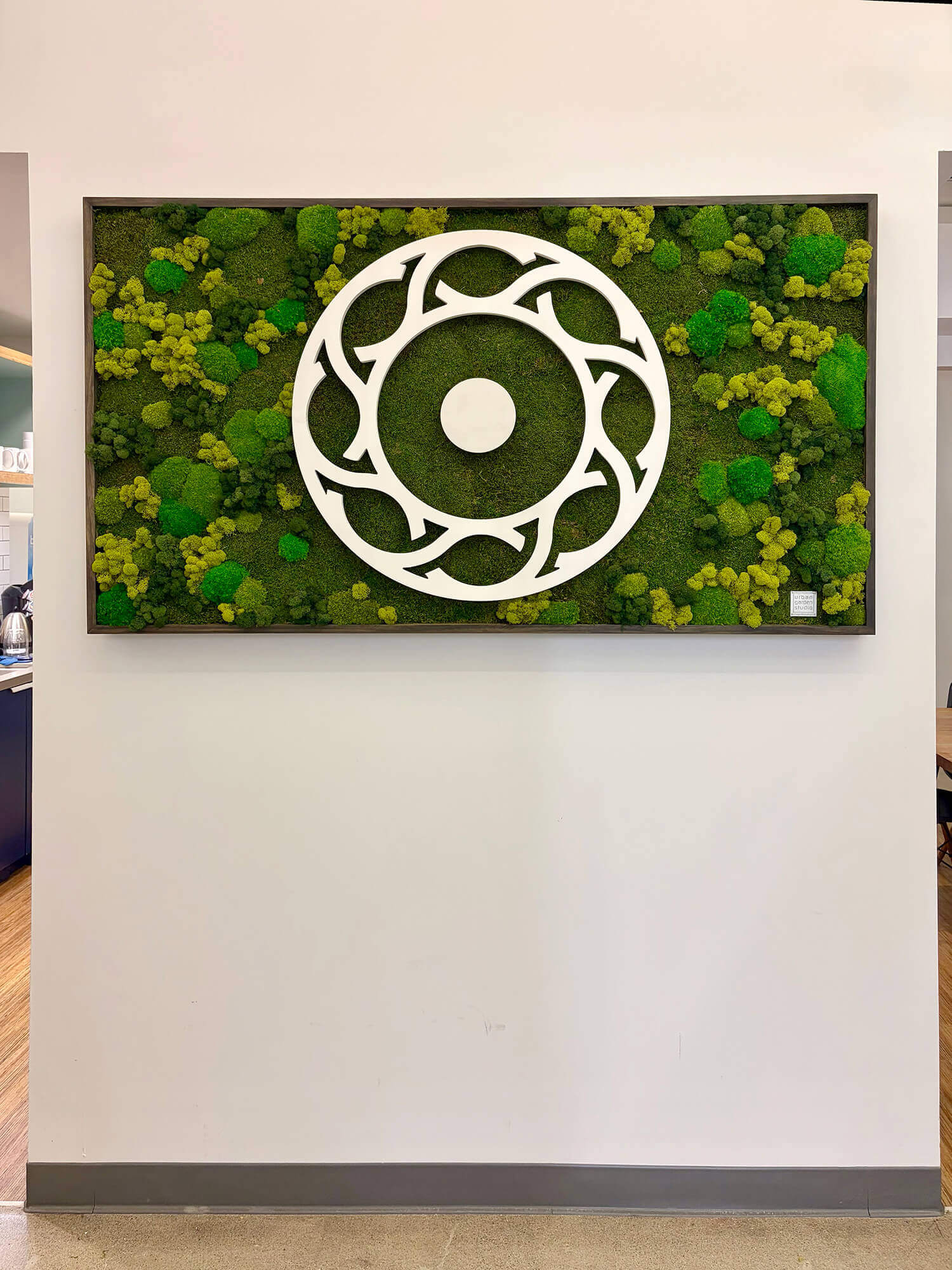 Corporate signage branding created with custom moss signage using a preserved moss wall and white corporate logo by Urban Garden Studio.